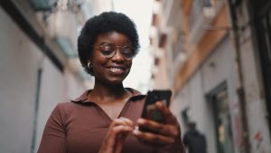 Person saving online transaction details on phone