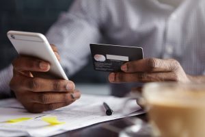 Person making a secure online payment with card